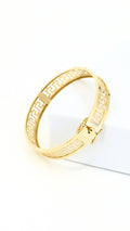 Greek meander design bracelet with clip-type lock.