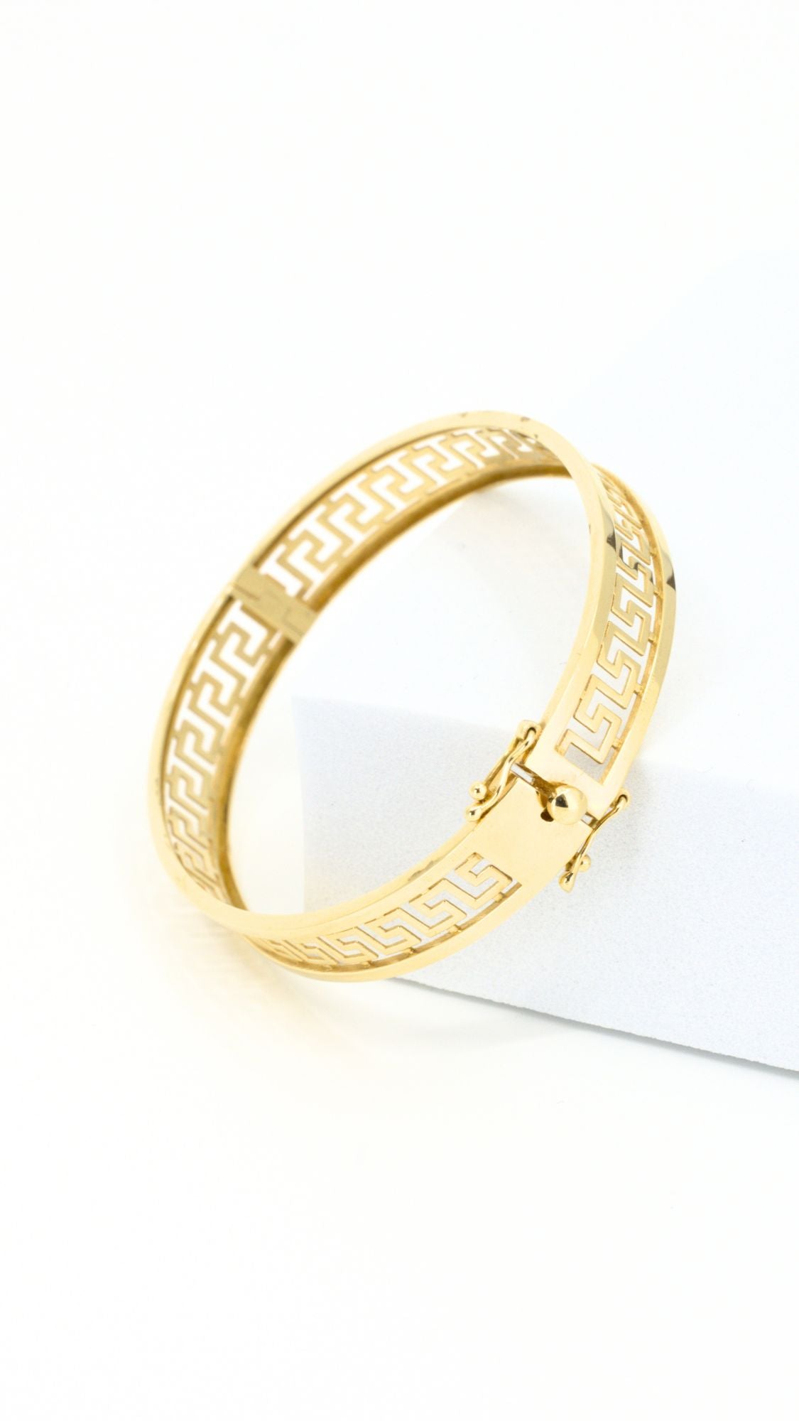 Greek meander design bracelet with clip-type lock.
